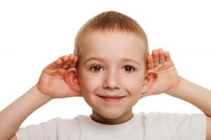 Child cupping ears - child listen to the sermon